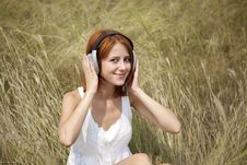 Beautiful Red-haired Girl At Grass With Headphones Stock Image Beautiful Red-haired Girl At Grass With Headphones Stock Image