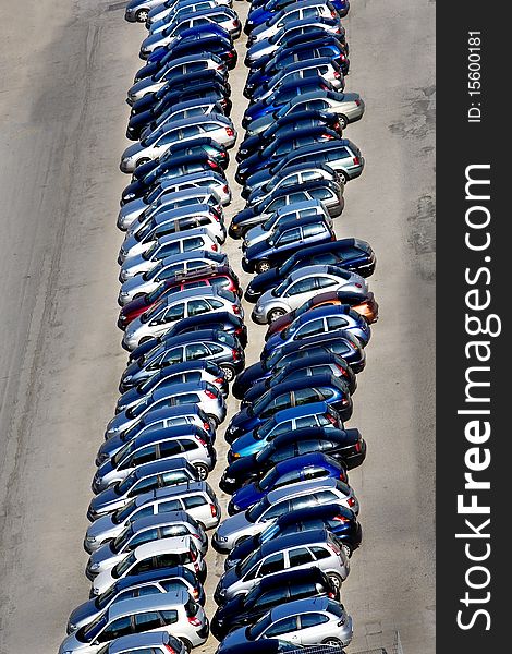 Vertical image of line of cars in a parking-lot seen from elevated point of view. Vertical image of line of cars in a parking-lot seen from elevated point of view