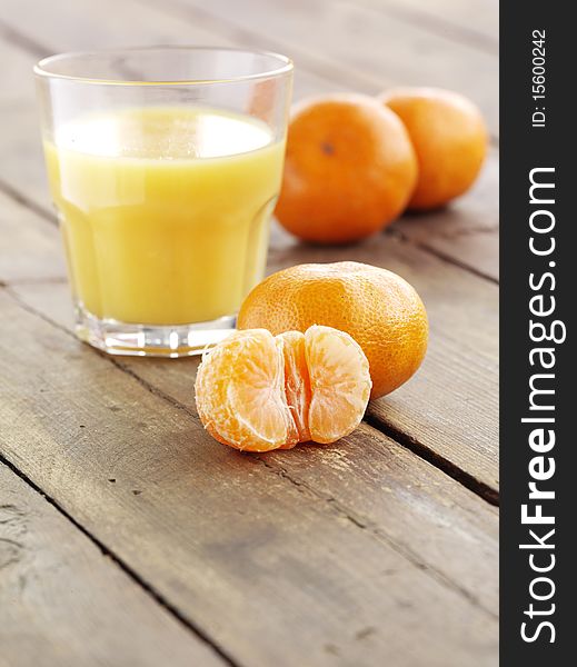 Appetizer mandarin and glass of fresh juice. Appetizer mandarin and glass of fresh juice