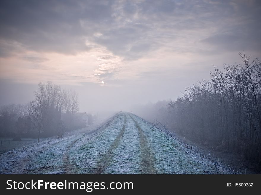 Dawn frost that forms near the river embankment settles like snow, Italy. Dawn frost that forms near the river embankment settles like snow, Italy