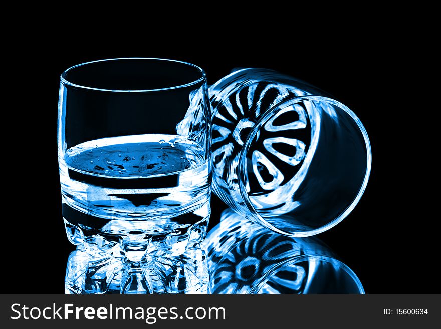 Two glasses isolated on black