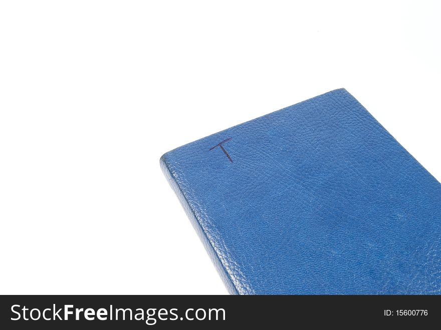 A blue notebook with a T on it