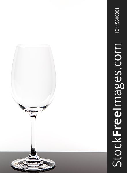 Empty white wine glass with white background