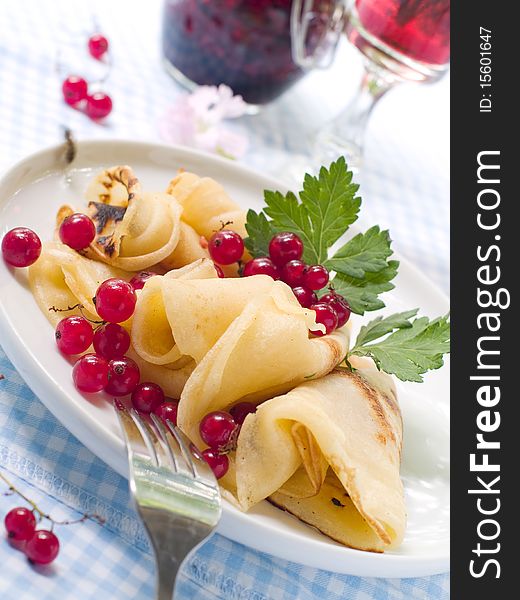 Pancakes with red currant jam for breakfast. Pancakes with red currant jam for breakfast