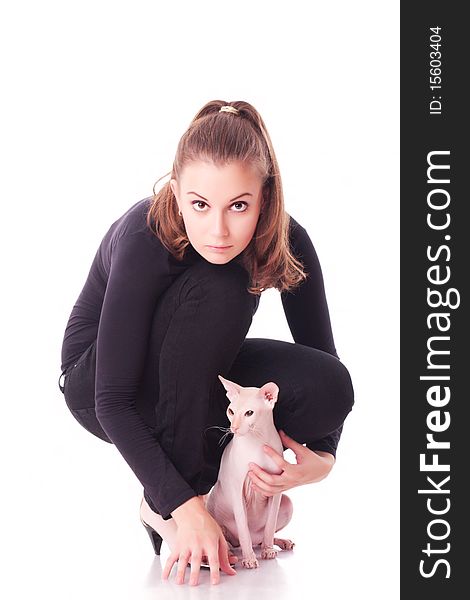 Beautiful young woman with a cat on a white background