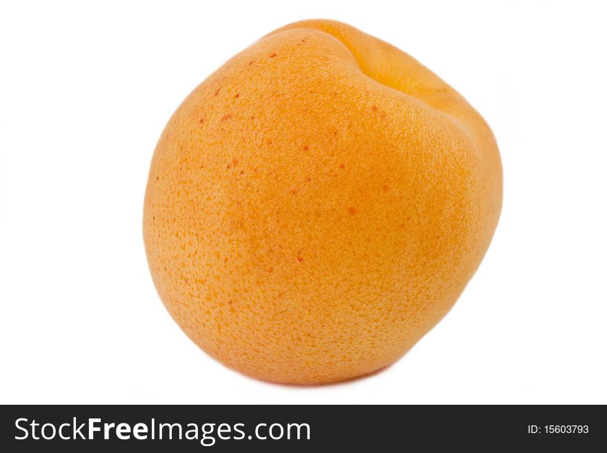Isolated apricot over white background. Macro, fruit texture visible