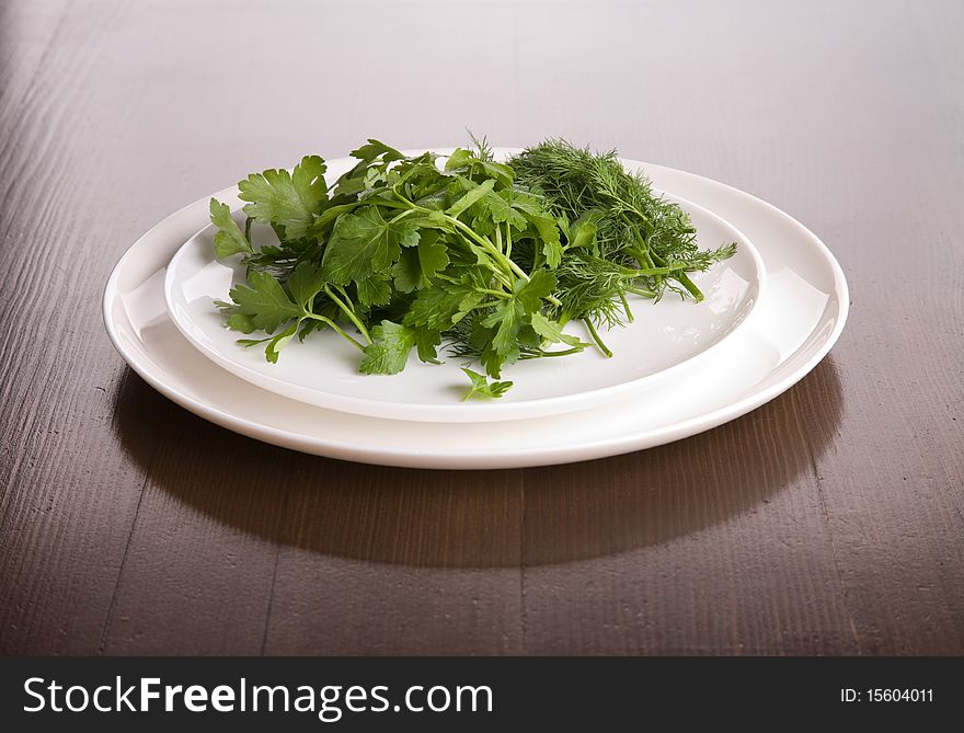 Dish with parsley and fennel on table