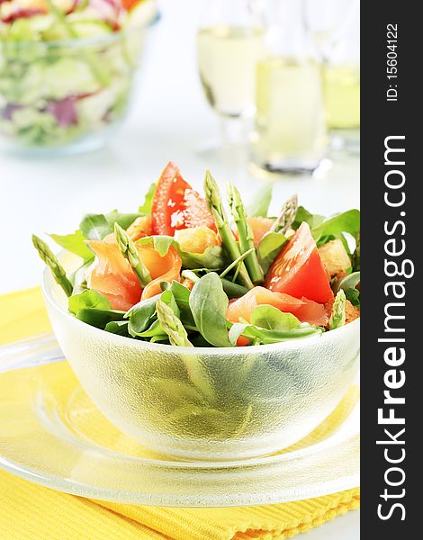 Fresh vegetable salad with smoked salmon and croutons