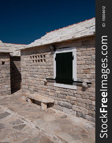 Croatian house made of white stone under the blue sky. Croatian house made of white stone under the blue sky.