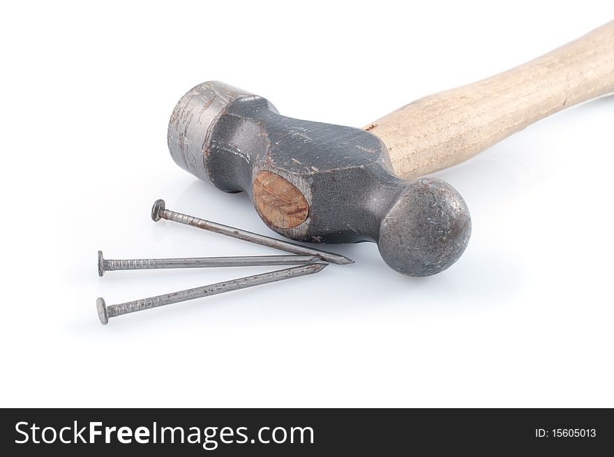 Hammer and nails on white background