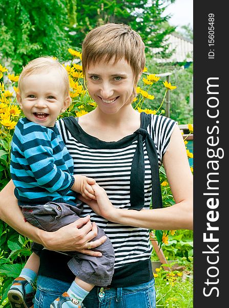 Portrait of mother and son in garden