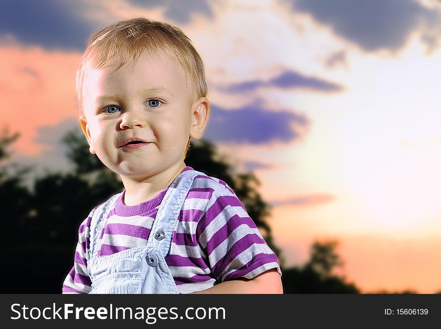 Outdoor portrait of cutie smiling kid. Outdoor portrait of cutie smiling kid