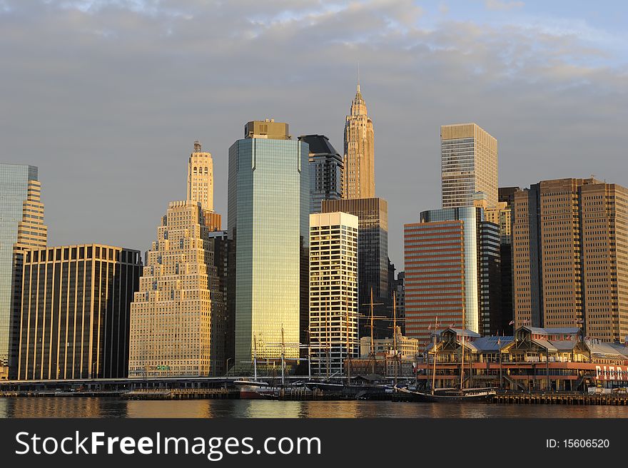 A striking photograph of a the skyline of downtown Manhattan photographed at sunrise. A striking photograph of a the skyline of downtown Manhattan photographed at sunrise.