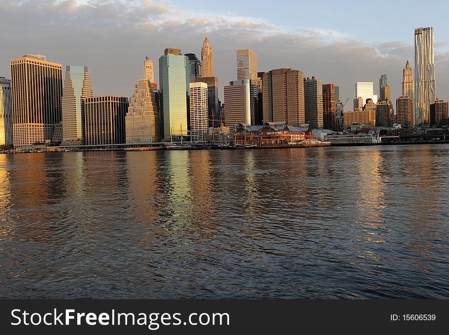 A striking photograph of a the skyline of downtown Manhattan photographed at sunrise. A striking photograph of a the skyline of downtown Manhattan photographed at sunrise.