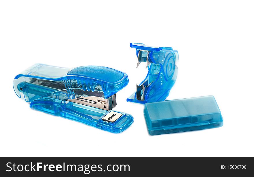 Stapler, staple remover and a box of staples isolated on white. Stapler, staple remover and a box of staples isolated on white