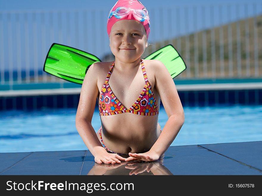 Little Child In Bathing Cap, Glasses, Fins Near Sw