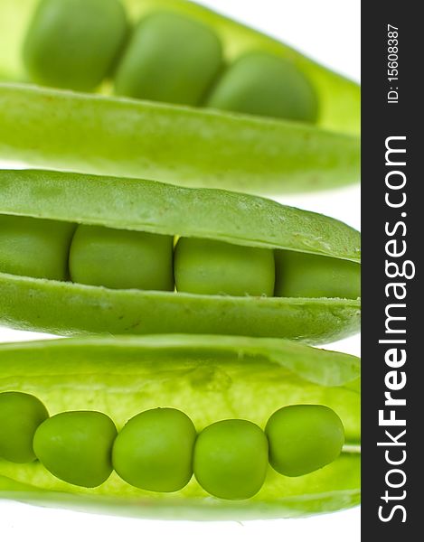 Three green peas detail, vertical detail, shallow depth of view. Three green peas detail, vertical detail, shallow depth of view