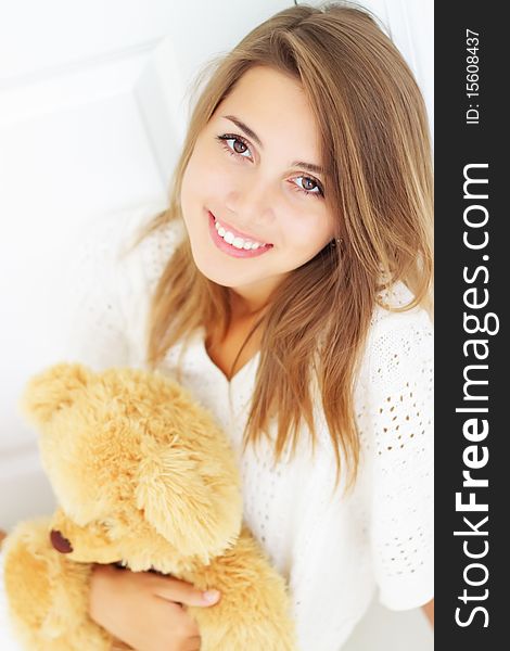 Beautiful girl holding a bear. Beautiful girl holding a bear