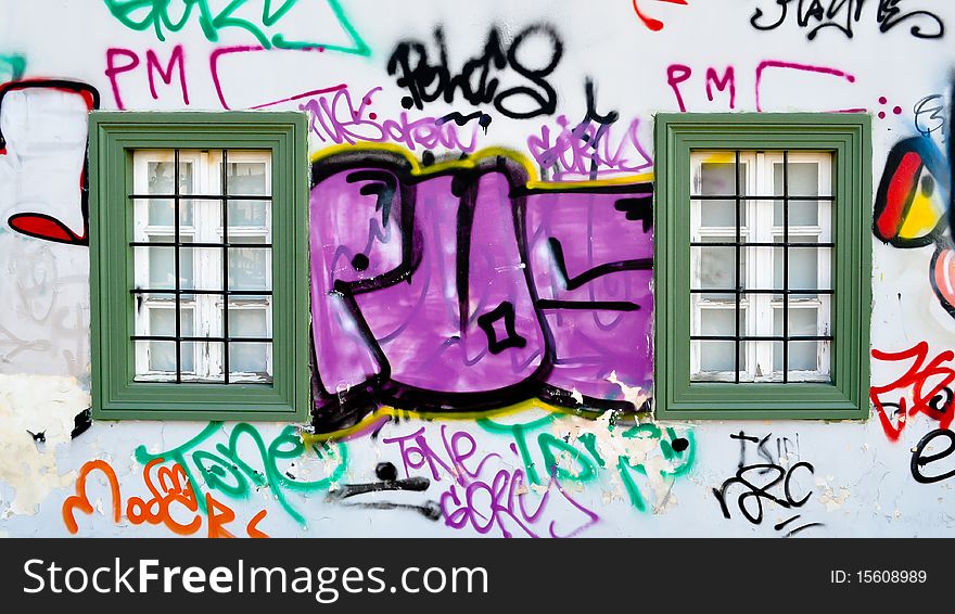 The wall of an old nursery school, covered with lively modern-time graffiti tags. Athens, Greece. The wall of an old nursery school, covered with lively modern-time graffiti tags. Athens, Greece.