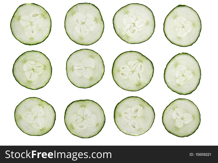 12 cucumber slices isolated on white background