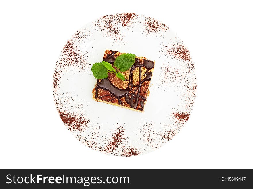 Cheesecake drenched in chocolate isolated on white