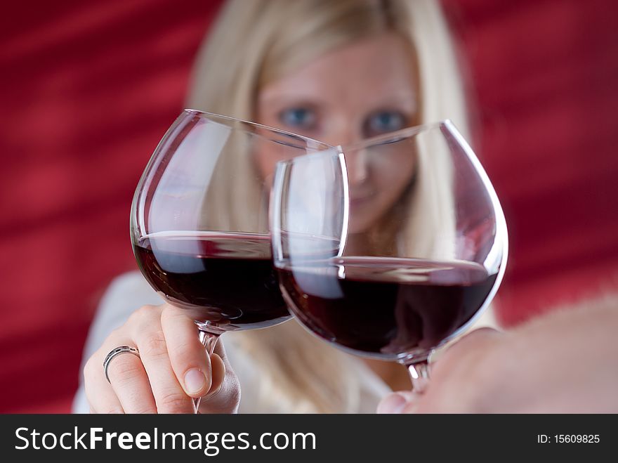 Young smiling women toast gesture with a man. Women looking into his eyes. Picture is take like from man eyes. Young smiling women toast gesture with a man. Women looking into his eyes. Picture is take like from man eyes.