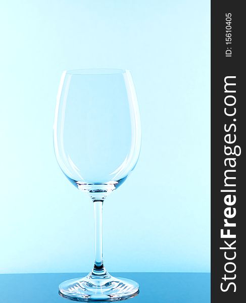 Red wine glass colored in blue