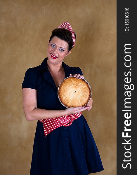 House wife with the pie in her hands. House wife with the pie in her hands