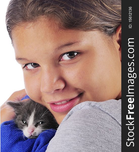 Close-up portrait of a young teen snuggling with her tiny gray and white kitten. Close-up portrait of a young teen snuggling with her tiny gray and white kitten.