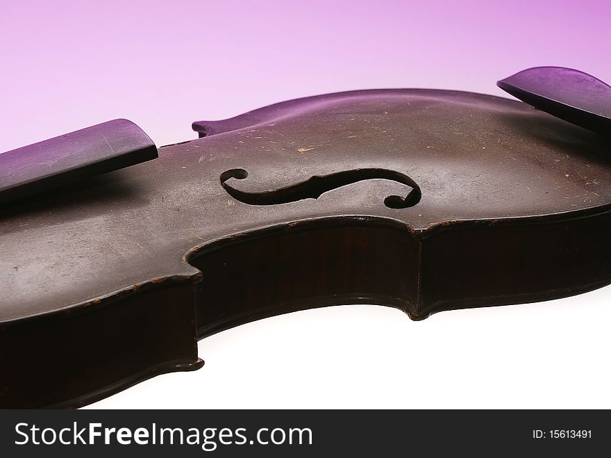 Old broken violin on a colored background. Old broken violin on a colored background