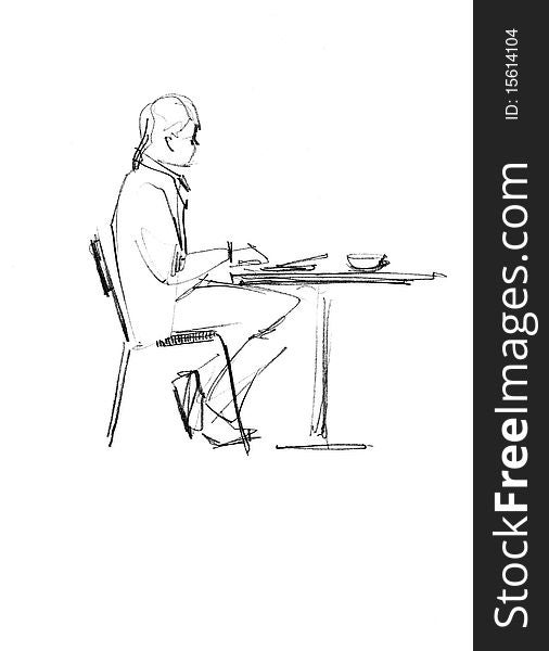 image of fellow sitting on a chair at the table. image of fellow sitting on a chair at the table