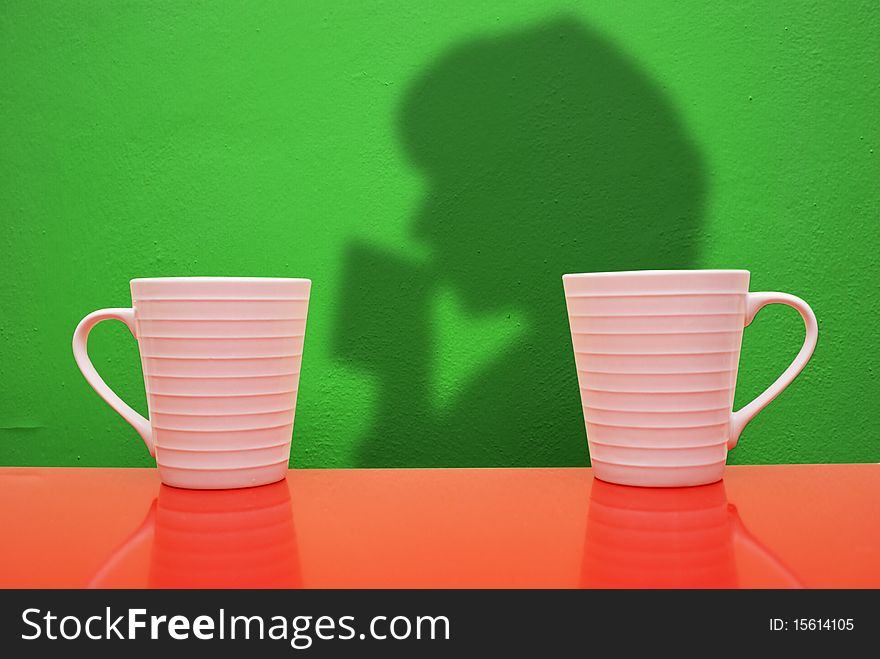 White cups on a colored background