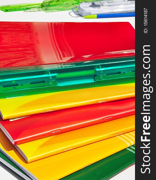 Colorful notebooks and binders spread. Colorful notebooks and binders spread