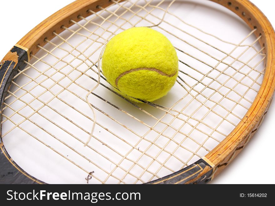 Old racket and tennis ball