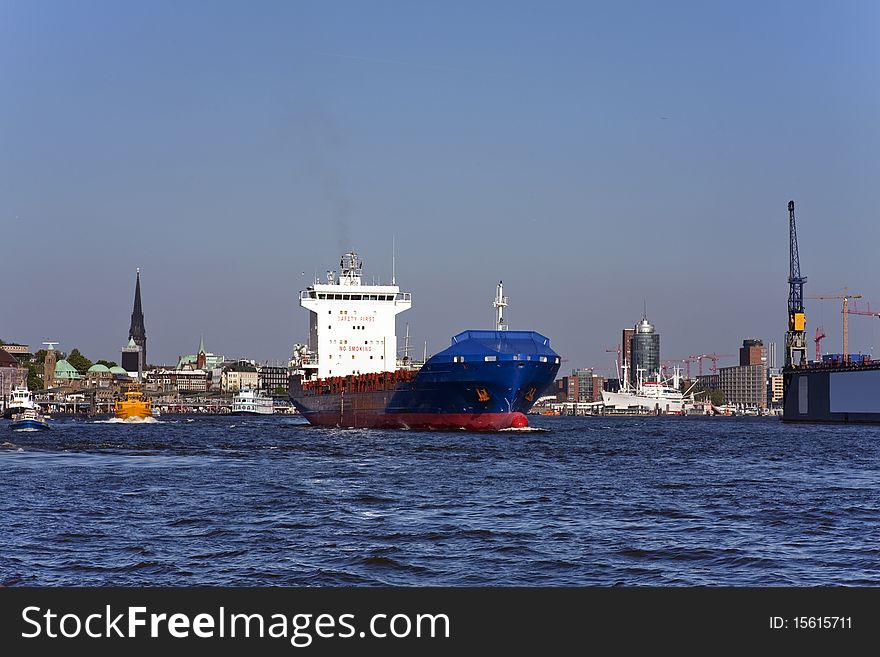Hamburg/Germany: Large nautical vessel pass famous harbor of Hamburg. Hamburg/Germany: Large nautical vessel pass famous harbor of Hamburg.