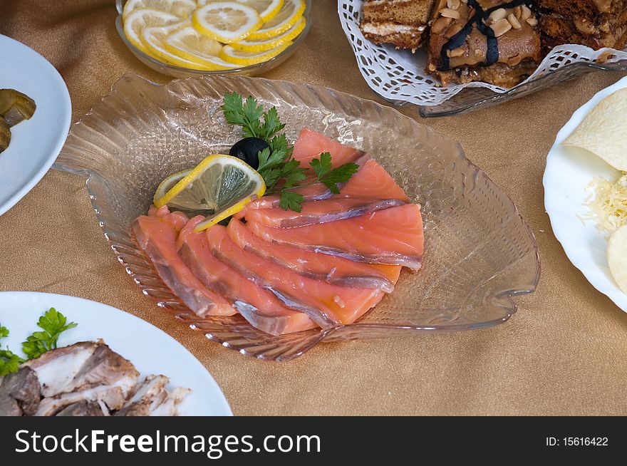 Fish delicacies on a festive table for a banquet. Fish delicacies on a festive table for a banquet.