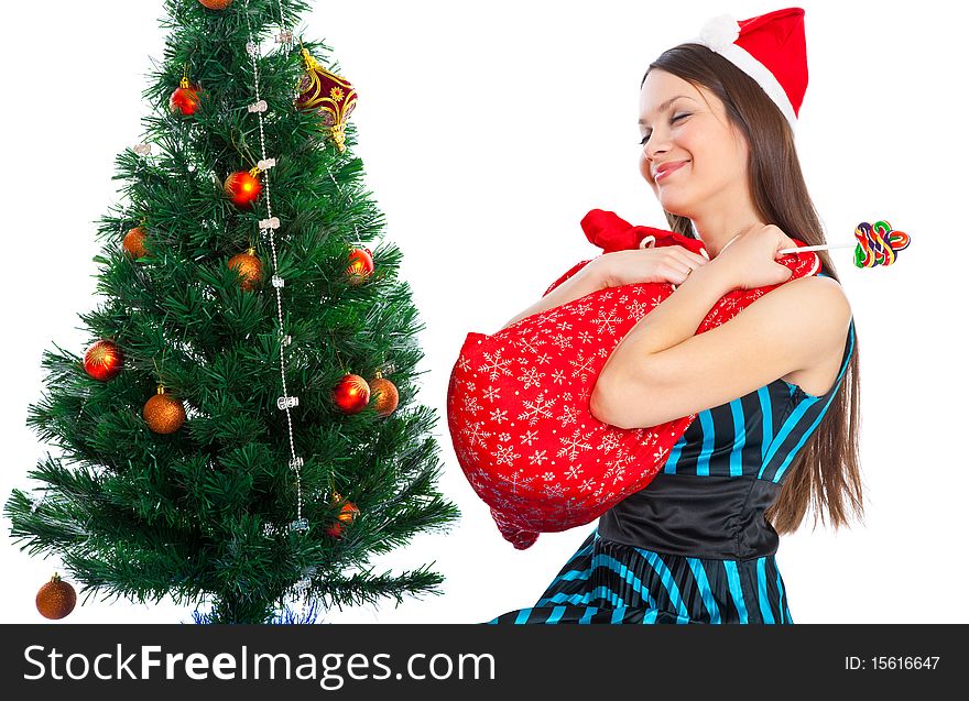 Girl near Christmas fir tree. Isolated on white