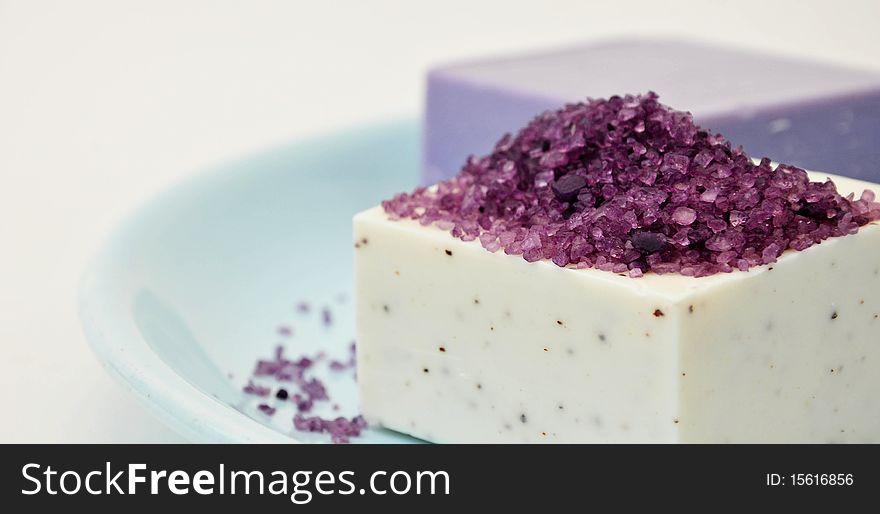 Soap bar with bath salt isolated on a white background