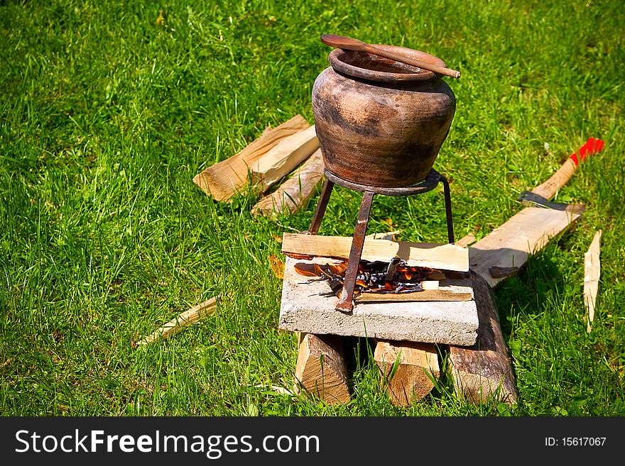 Traditional cooking food outdoors on the fire