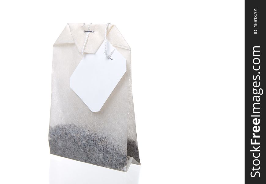 Close-up of tea bag isolated on white background