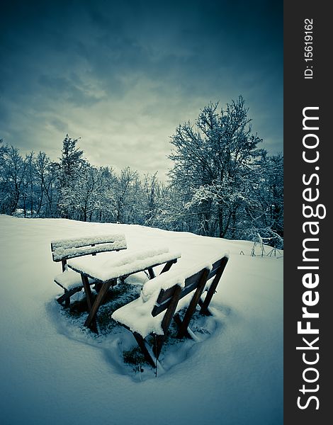 Benches and a table covered in snow, Italy, Emilian Apennines. Benches and a table covered in snow, Italy, Emilian Apennines