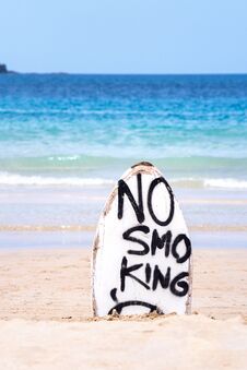 No Smoking Warning Sign On White Surfboard At The Beach In Summer, Concept Of Sea Environmantal Protection Design, Copy Space, Royalty Free Stock Photos