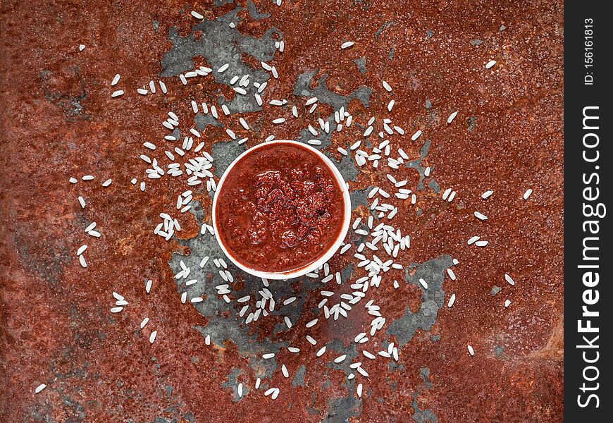 Gochujang. Traditional Korean soybean paste with sticky rice and fermented soybeans, dressed with red pepper in high concentration in a white bowl