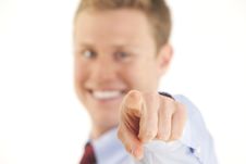 Smiling Young Businessman Pointing Finger At Camer Stock Images