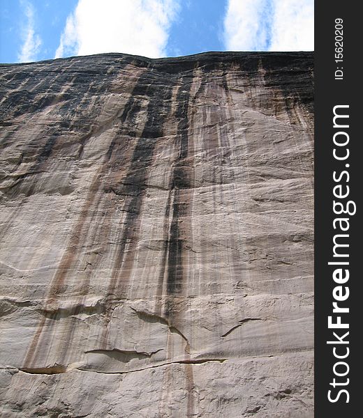 A large canyon wall on the edge of a southern utah river