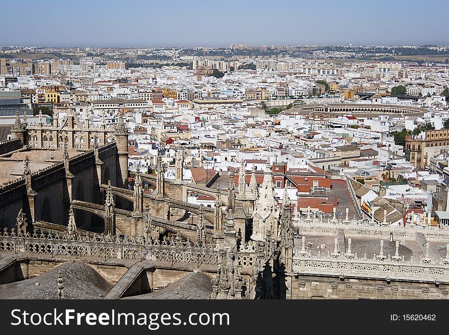 City overview of Seville, Spain.
In the background: Plaza del Toros, in the foreground: Giralda Cathedral.