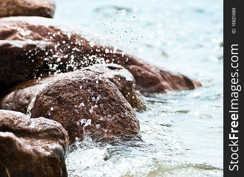 Close up of stones on the shore of a lake