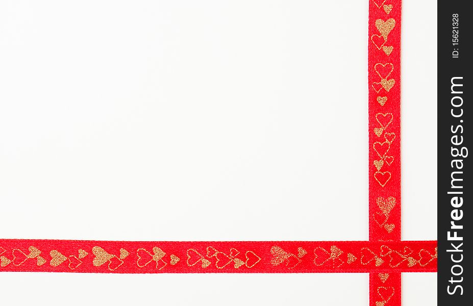 Red ribbon decorated with hearts against white background. Red ribbon decorated with hearts against white background