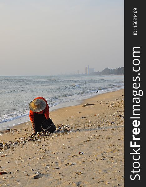 Old woman at Cha-am Beach ,Thailand