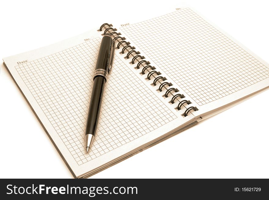 The image of the notepad and pen